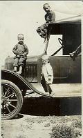  From left to right, Wesley Turner, Lester Turner (on top), and Charles Edward Turner (on car runner).